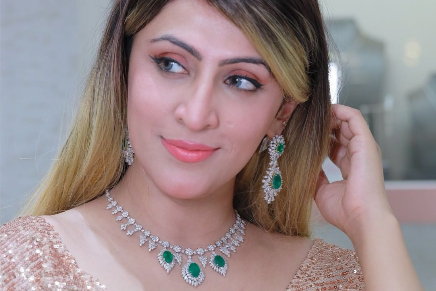 woman wearing emerald jewelry